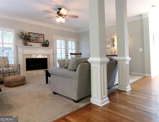 21 Devin Ln, Euharlee, GA 30145 - living area with wood finished floors, ornamental molding, a fireplace with flush hearth, ornate columns, and a ceiling fan