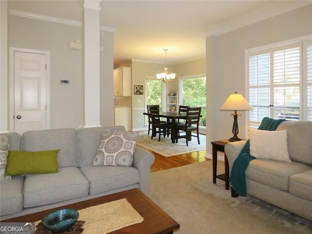 21 Devin Ln, Euharlee, GA 30145 - living area with ornamental molding, a chandelier, wood finished floors, and ornate columns
