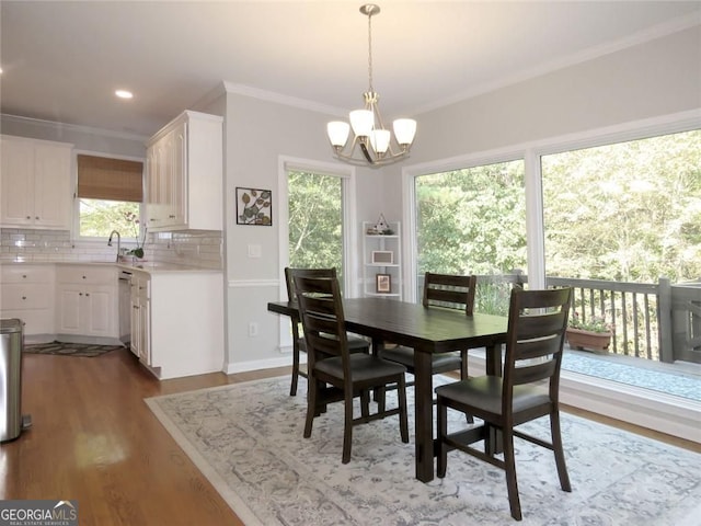 21 Devin Ln, Euharlee, GA 30145 - dining area with crown molding, a chandelier, wood finished floors, and recessed lighting