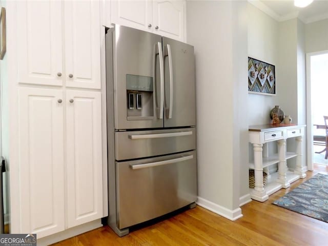 21 Devin Ln, Euharlee, GA 30145 - kitchen with stainless steel refrigerator with ice dispenser, crown molding, white cabinets, and light wood-style floors