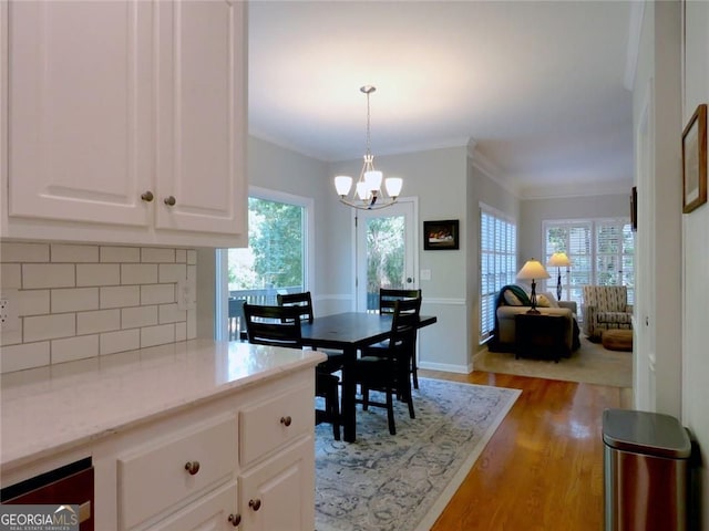21 Devin Ln, Euharlee, GA 30145 - dining room featuring a chandelier, plenty of natural light, and light wood-style floors