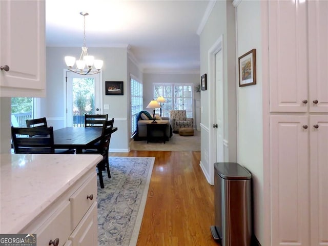 21 Devin Ln, Euharlee, GA 30145 - dining room with a chandelier, light wood finished floors, and crown molding