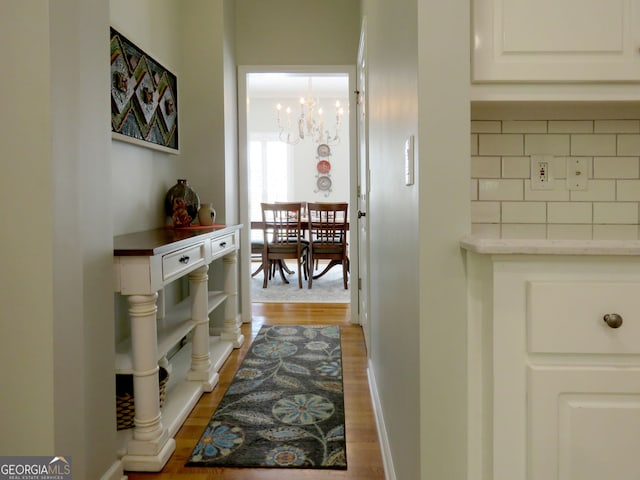 21 Devin Ln, Euharlee, GA 30145 - corridor with a chandelier and light wood-style floors