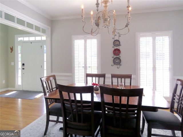 21 Devin Ln, Euharlee, GA 30145 - dining space featuring wood finished floors, a chandelier, and crown molding