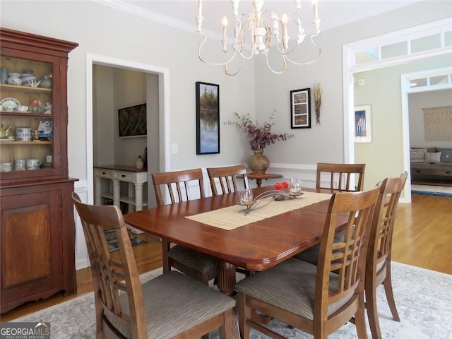 21 Devin Ln, Euharlee, GA 30145 - dining space featuring ornamental molding, a chandelier, and light wood finished floors