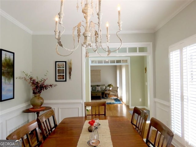 21 Devin Ln, Euharlee, GA 30145 - dining room featuring a chandelier, crown molding, a decorative wall, wood finished floors, and wainscoting