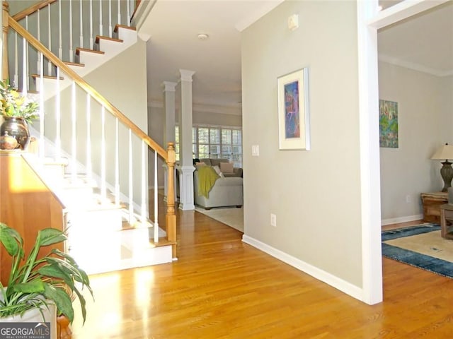21 Devin Ln, Euharlee, GA 30145 - foyer with ornamental molding, wood finished floors, stairs, and decorative columns