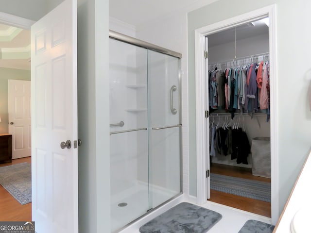 21 Devin Ln, Euharlee, GA 30145 - full bathroom with a stall shower, crown molding, a walk in closet, and wood finished floors