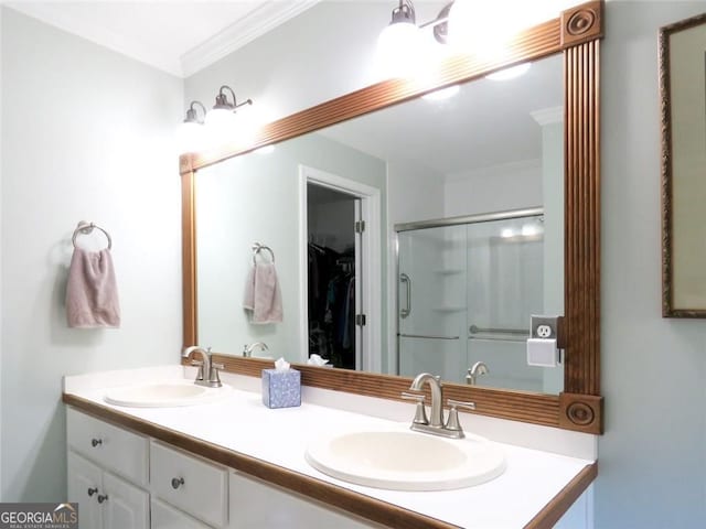 21 Devin Ln, Euharlee, GA 30145 - bathroom featuring double vanity, a shower stall, a walk in closet, and crown molding