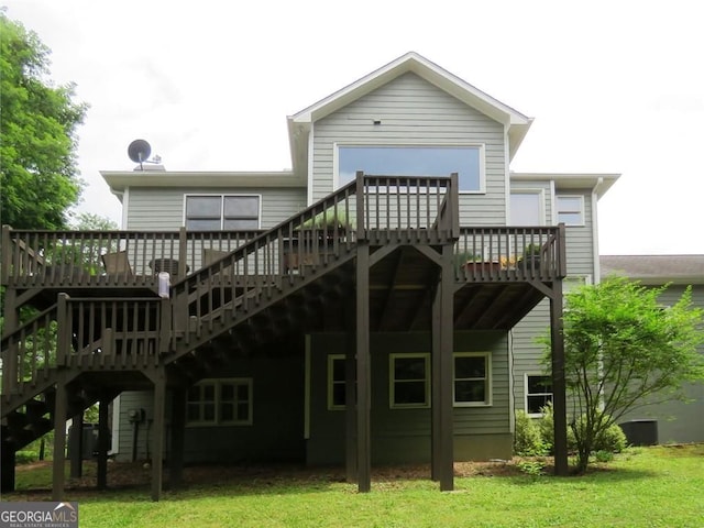 21 Devin Ln, Euharlee, GA 30145 - rear view of house with stairway, a wooden deck, and a lawn