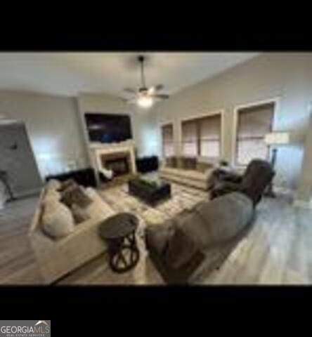 406 Clifton Rd, Perry, GA 31069 - living area featuring a ceiling fan and a fireplace