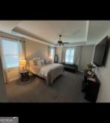 406 Clifton Rd, Perry, GA 31069 - bedroom with a tray ceiling and a ceiling fan