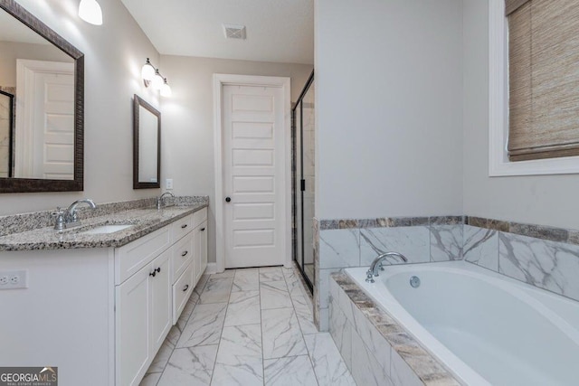 406 Clifton Rd, Perry, GA 31069 - bathroom with marble finish flooring, a bath, double vanity, and a stall shower