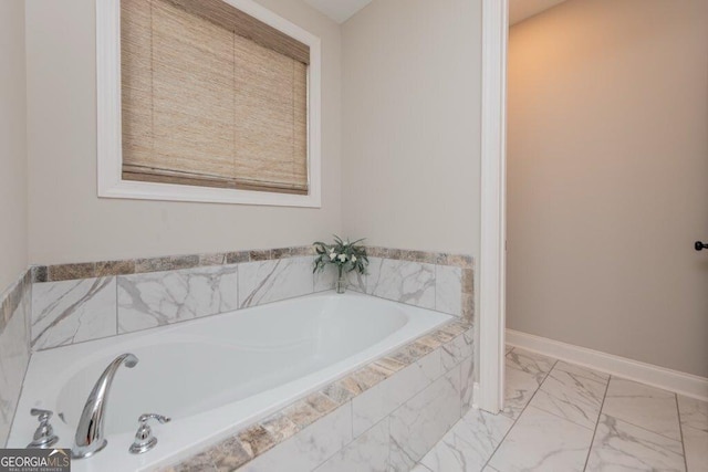 406 Clifton Rd, Perry, GA 31069 - full bathroom with a garden tub, marble look tile flooring, and baseboards