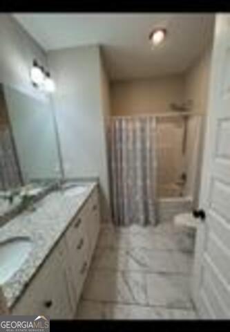 406 Clifton Rd, Perry, GA 31069 - bathroom featuring double vanity and bathtub / shower combination