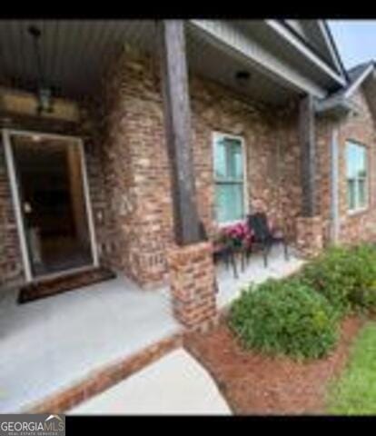 406 Clifton Rd, Perry, GA 31069 - entrance to property featuring brick siding and a porch