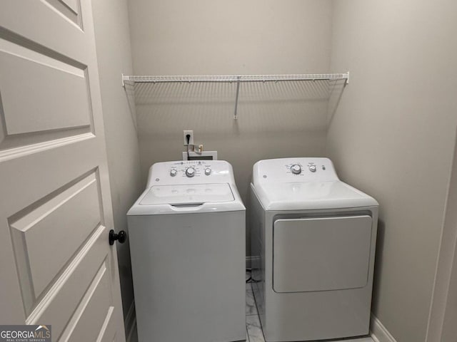 406 Clifton Rd, Perry, GA 31069 - laundry room with separate washer and dryer, marble finish floors, and baseboards