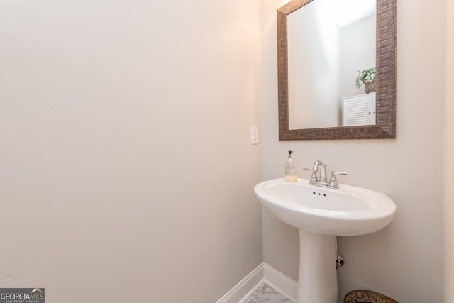 406 Clifton Rd, Perry, GA 31069 - bathroom with baseboards and marble finish flooring