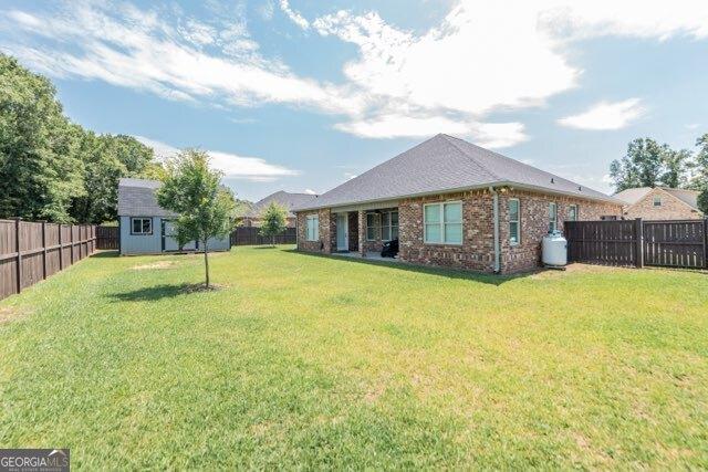 406 Clifton Rd, Perry, GA 31069 - rear view of property with brick siding