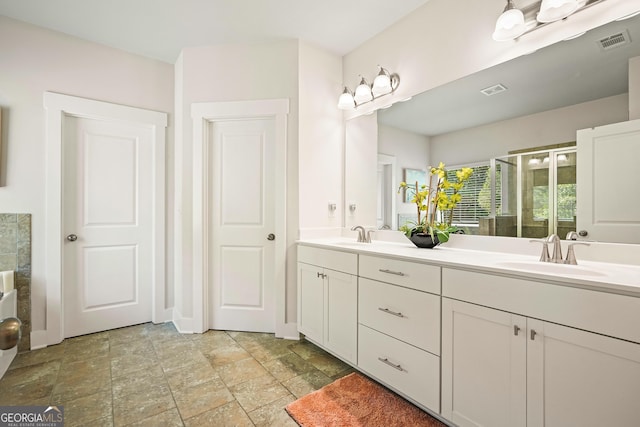 383 Crestbrook Ln, Dallas, GA 30157 - full bath with double vanity, stone finish flooring, and a stall shower