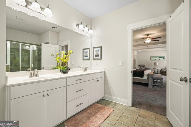 383 Crestbrook Ln, Dallas, GA 30157 - full bath with ensuite bath, double vanity, a stall shower, a ceiling fan, and baseboards