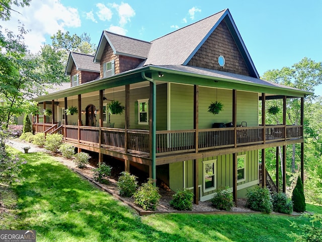 421 Hickory Nut Mountain Rd, Tallulah Falls, GA 30573 - back of house with roof with shingles, a lawn, a wooden deck, and board and batten siding