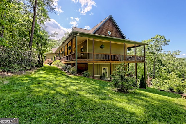 421 Hickory Nut Mountain Rd, Tallulah Falls, GA 30573 - back of property featuring a lawn and a deck