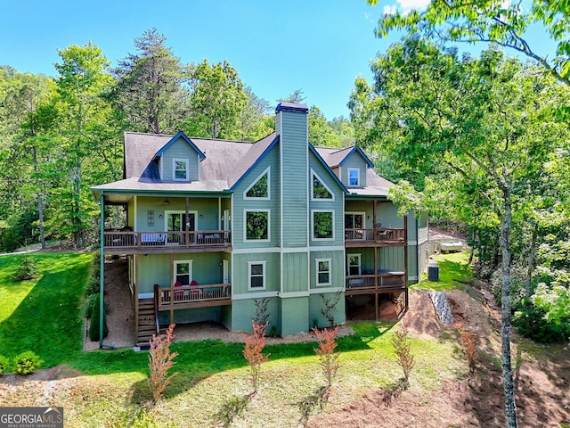 421 Hickory Nut Mountain Rd, Tallulah Falls, GA 30573 - rear view of property with ceiling fan, a balcony, a lawn, a chimney, and a wooden deck