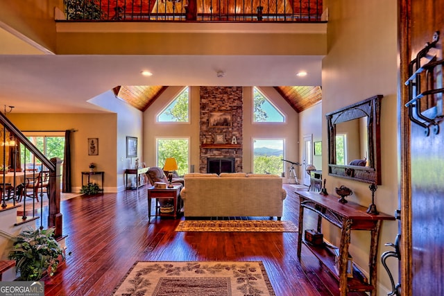 421 Hickory Nut Mountain Rd, Tallulah Falls, GA 30573 - living room featuring high vaulted ceiling, plenty of natural light, hardwood / wood-style floors, a stone fireplace, and recessed lighting
