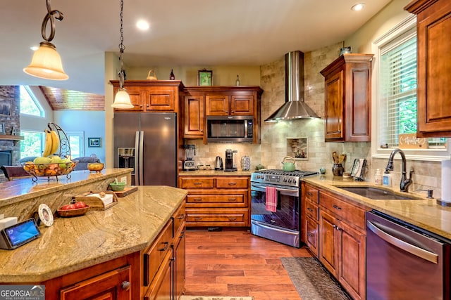 421 Hickory Nut Mountain Rd, Tallulah Falls, GA 30573 - kitchen featuring stainless steel appliances, wall chimney range hood, dark wood-style flooring, light stone counters, and tasteful backsplash