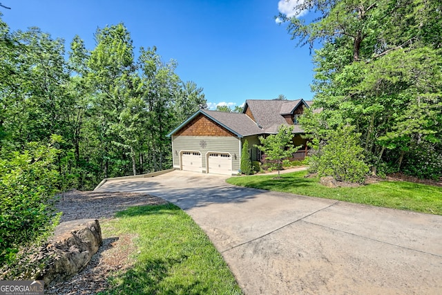 421 Hickory Nut Mountain Rd, Tallulah Falls, GA 30573 - view of front of property featuring driveway, a garage, and a front lawn