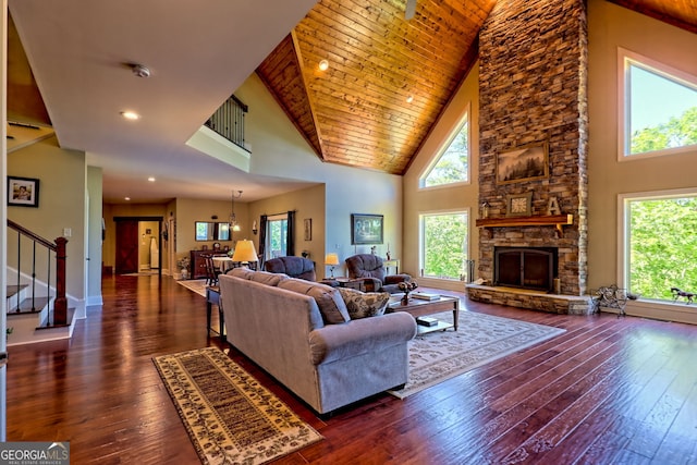 421 Hickory Nut Mountain Rd, Tallulah Falls, GA 30573 - living area featuring high vaulted ceiling, healthy amount of natural light, stairway, and wood-type flooring