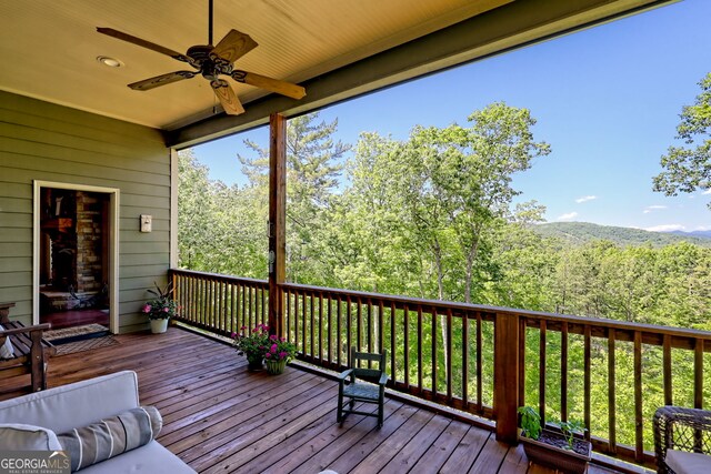 421 Hickory Nut Mountain Rd, Tallulah Falls, GA 30573 - deck featuring ceiling fan and a wooded view
