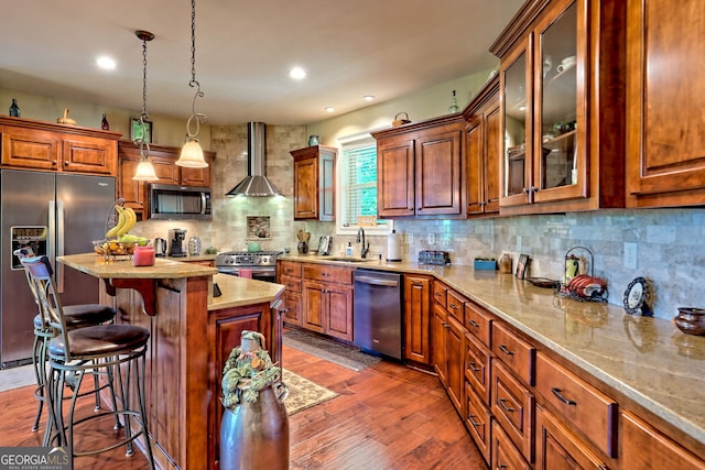 421 Hickory Nut Mountain Rd, Tallulah Falls, GA 30573 - kitchen with stainless steel appliances, wall chimney exhaust hood, a kitchen breakfast bar, tasteful backsplash, and light stone countertops