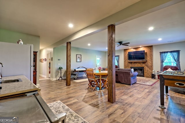 421 Hickory Nut Mountain Rd, Tallulah Falls, GA 30573 - living room with a ceiling fan, a fireplace, healthy amount of natural light, wood finished floors, and recessed lighting