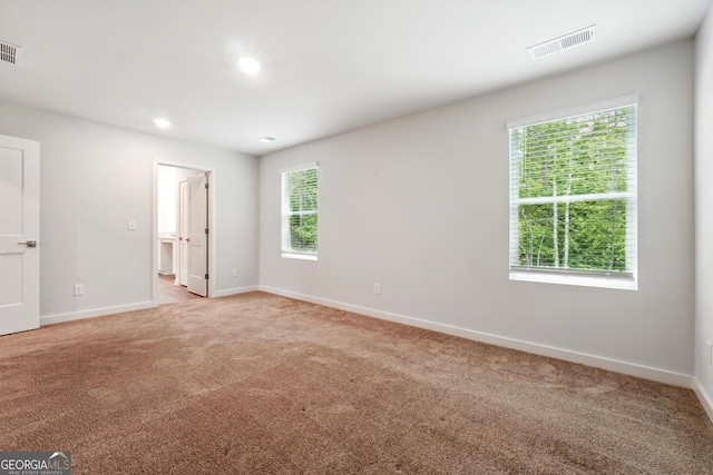 768 Great Oak Pl Unit 26, Villa Rica, GA 30180 - unfurnished bedroom with light colored carpet, baseboards, recessed lighting, and ensuite bath