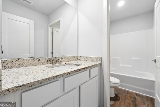 768 Great Oak Pl Unit 26, Villa Rica, GA 30180 - full bathroom with toilet, wood finished floors, vanity, and tub / shower combination