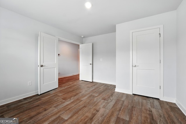 768 Great Oak Pl Unit 26, Villa Rica, GA 30180 - unfurnished bedroom with baseboards and wood finished floors