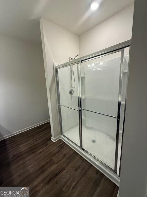 170 Forray Dr, Covington, GA 30016 - full bathroom featuring wood finished floors, baseboards, and a shower stall