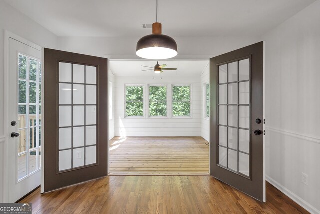 5523 River Valley Way, Flowery Branch, GA 30542 - doorway featuring wood finished floors, french doors, ceiling fan, and baseboards