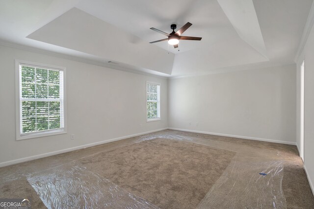 5523 River Valley Way, Flowery Branch, GA 30542 - spare room featuring a raised ceiling, carpet floors, ceiling fan, ornamental molding, and baseboards