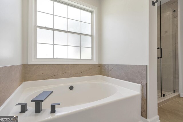 5523 River Valley Way, Flowery Branch, GA 30542 - full bath with a garden tub and a stall shower