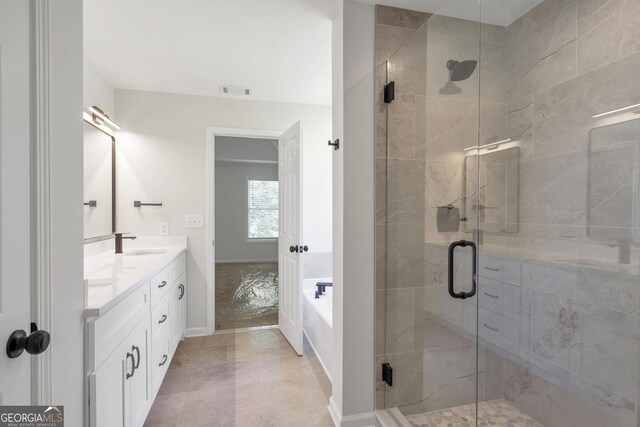 5523 River Valley Way, Flowery Branch, GA 30542 - full bathroom featuring double vanity, a stall shower, and a garden tub