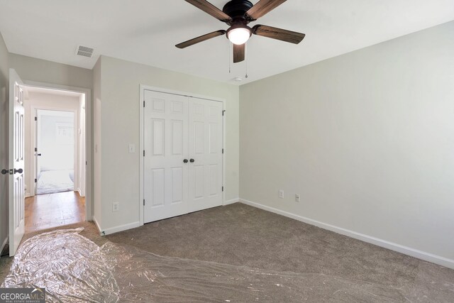 5523 River Valley Way, Flowery Branch, GA 30542 - unfurnished bedroom with carpet floors, baseboards, a closet, and ceiling fan