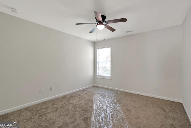 5523 River Valley Way, Flowery Branch, GA 30542 - carpeted spare room featuring baseboards, a ceiling fan, and a smoke detector