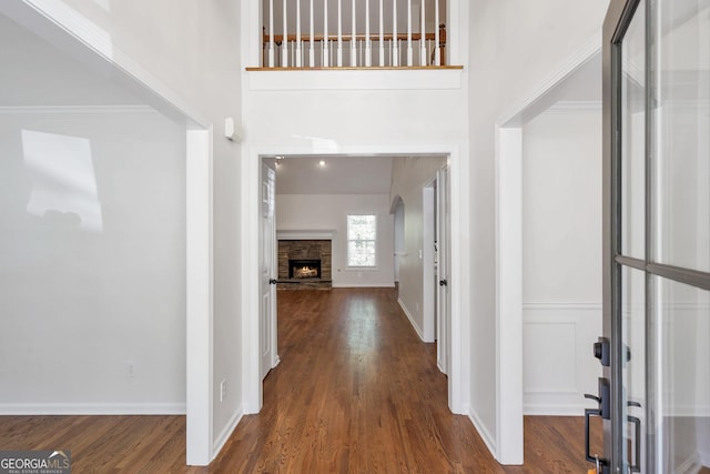 5523 River Valley Way, Flowery Branch, GA 30542 - entrance foyer featuring wood finished floors, a fireplace, and baseboards