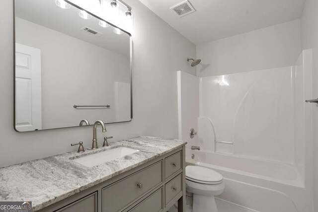 5523 River Valley Way, Flowery Branch, GA 30542 - full bath with vanity, toilet, and bathing tub / shower combination