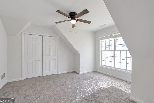 5523 River Valley Way, Flowery Branch, GA 30542 - additional living space featuring vaulted ceiling, carpet floors, a ceiling fan, and baseboards