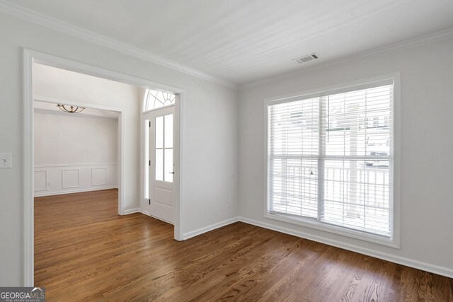 5523 River Valley Way, Flowery Branch, GA 30542 - empty room featuring wood finished floors, crown molding, and baseboards