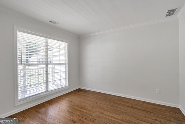 5523 River Valley Way, Flowery Branch, GA 30542 - empty room featuring dark wood-type flooring, ornamental molding, and baseboards